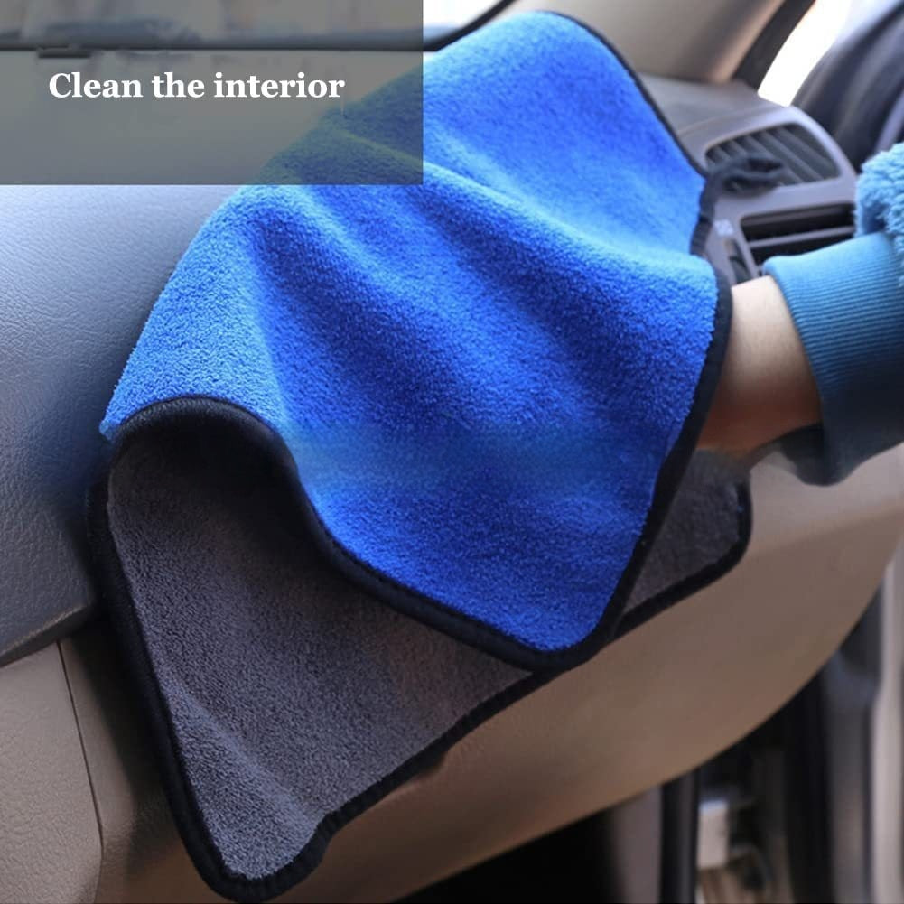 Blue microfiber towel being used to clean a car interior.