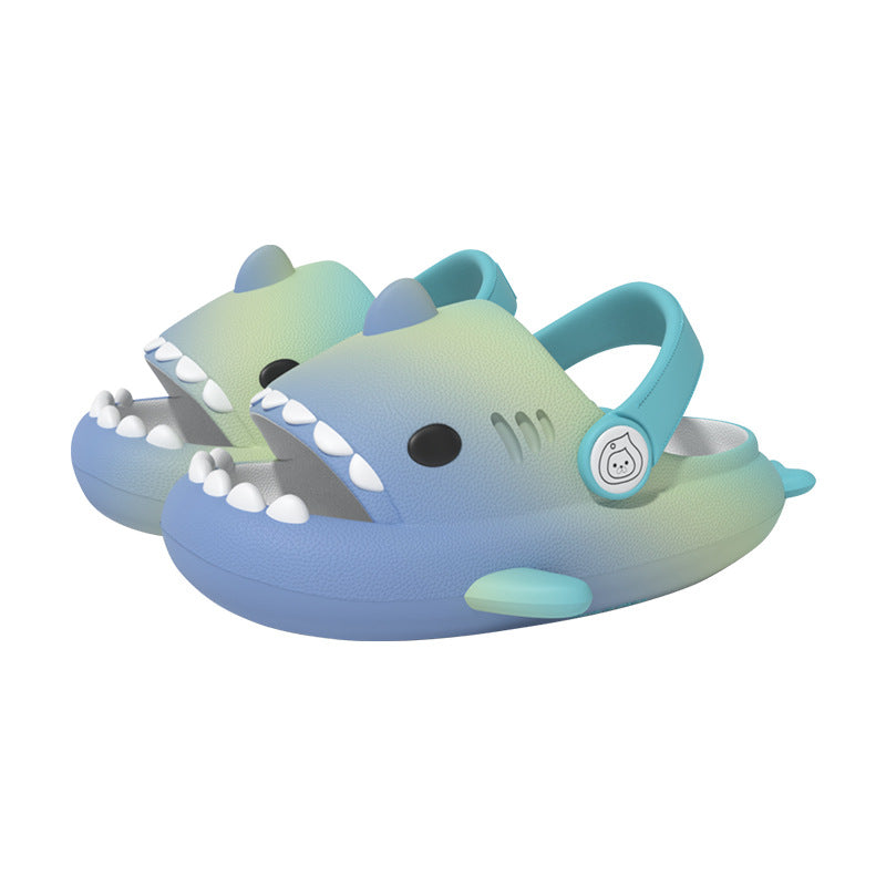 Gradient blue and green shark-shaped clogs on a white background