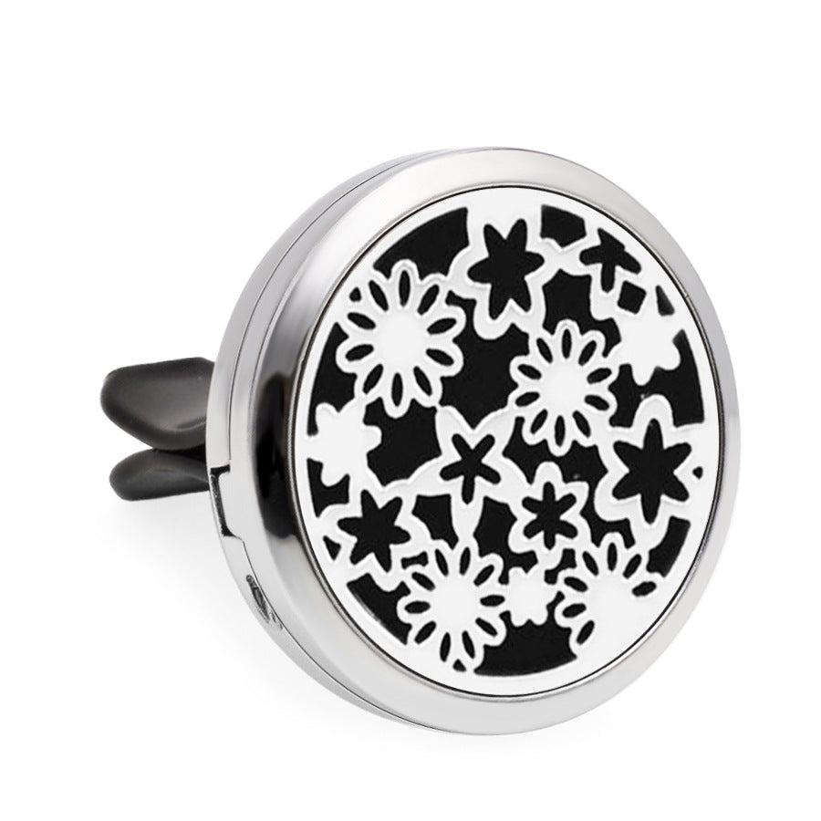 Round black and white floral design diffuser on a white background