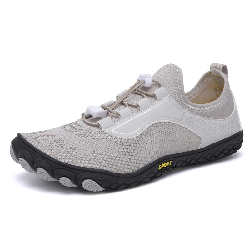 White athletic shoe with black sole on a white background