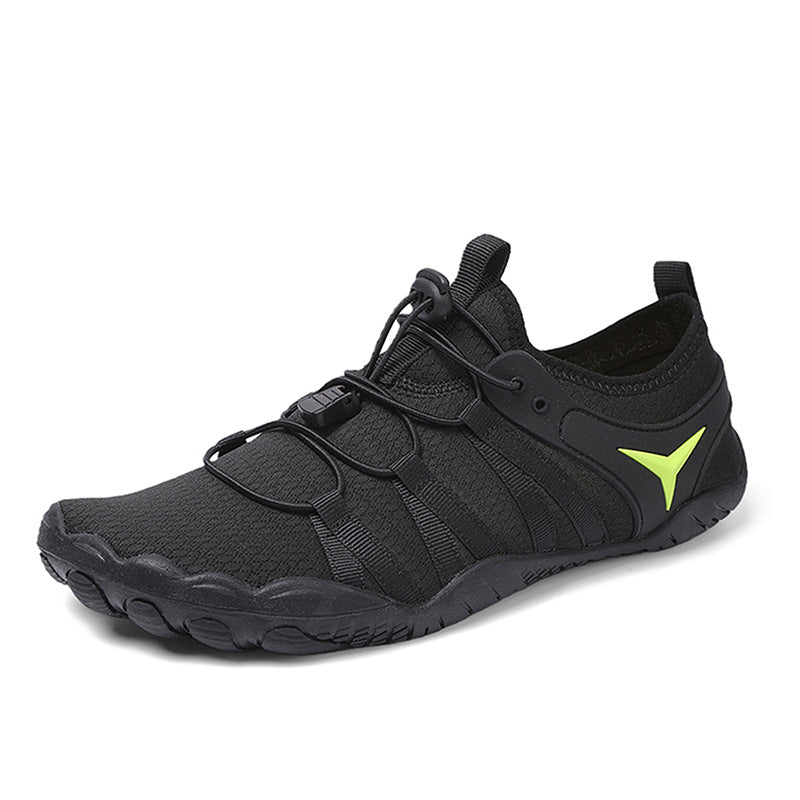 Black athletic shoe with a green logo on a white background