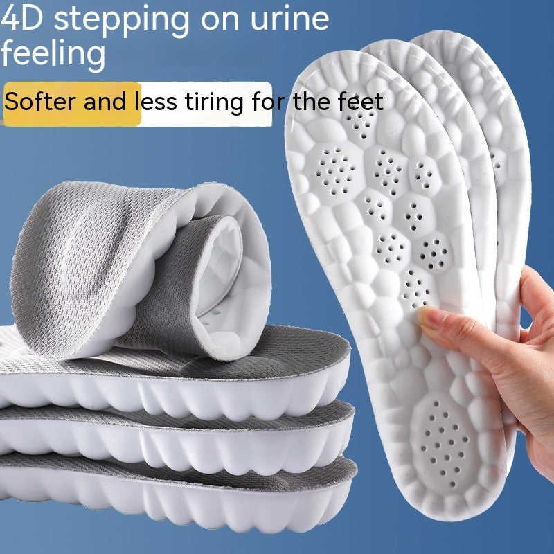 Stack of white and gray shoe inserts with a hand holding one, on a blue background.