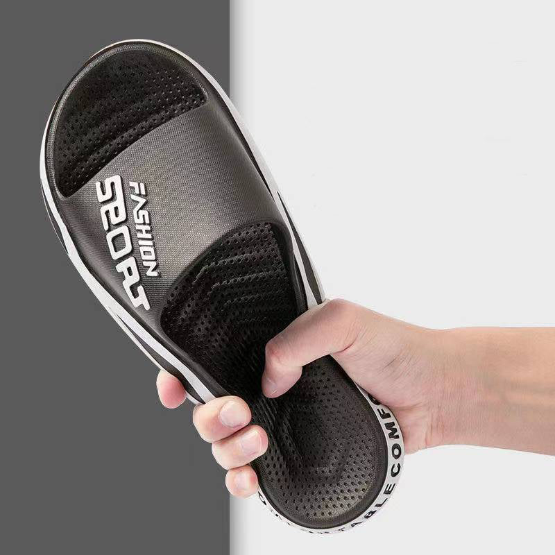 Black sandal held by a hand with text on a gray and white background