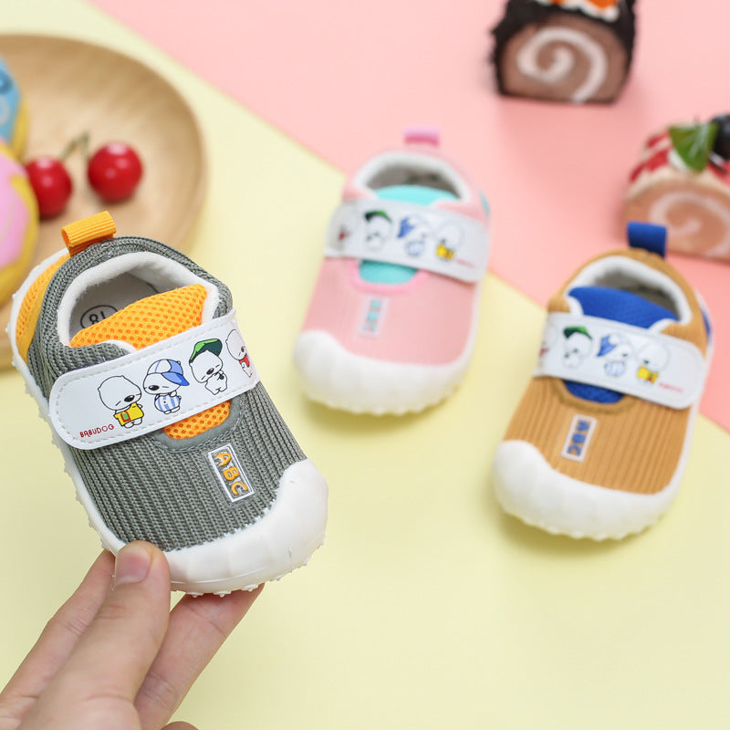Three pairs of children's shoes with cartoon designs on a colorful background