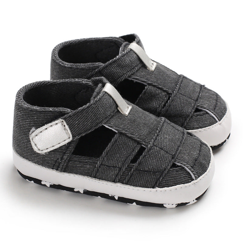 Pair of gray sandals with white soles on a white background