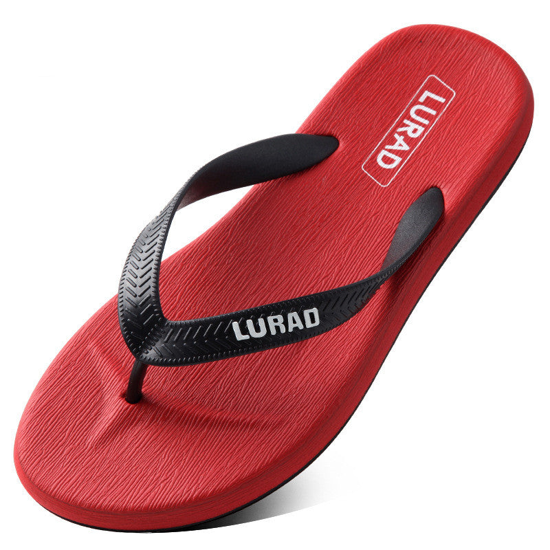 Red flip-flop sandal with black strap on a white background