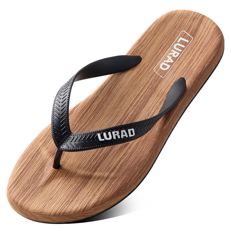Wooden sandal with black strap on a white background