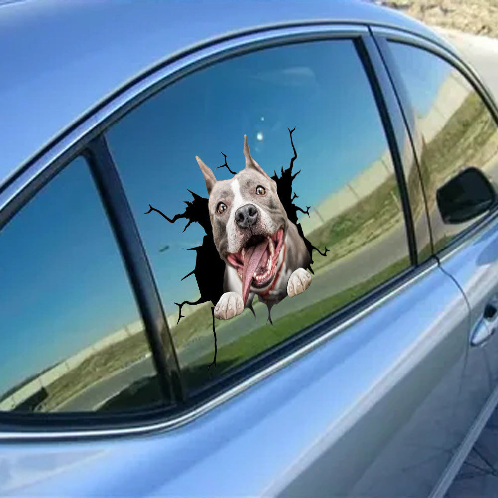 Car window with a dog sticker of a pit bull peering through a cracked window.
