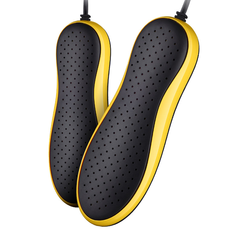 Black shoe inserts with yellow edges on a white background
