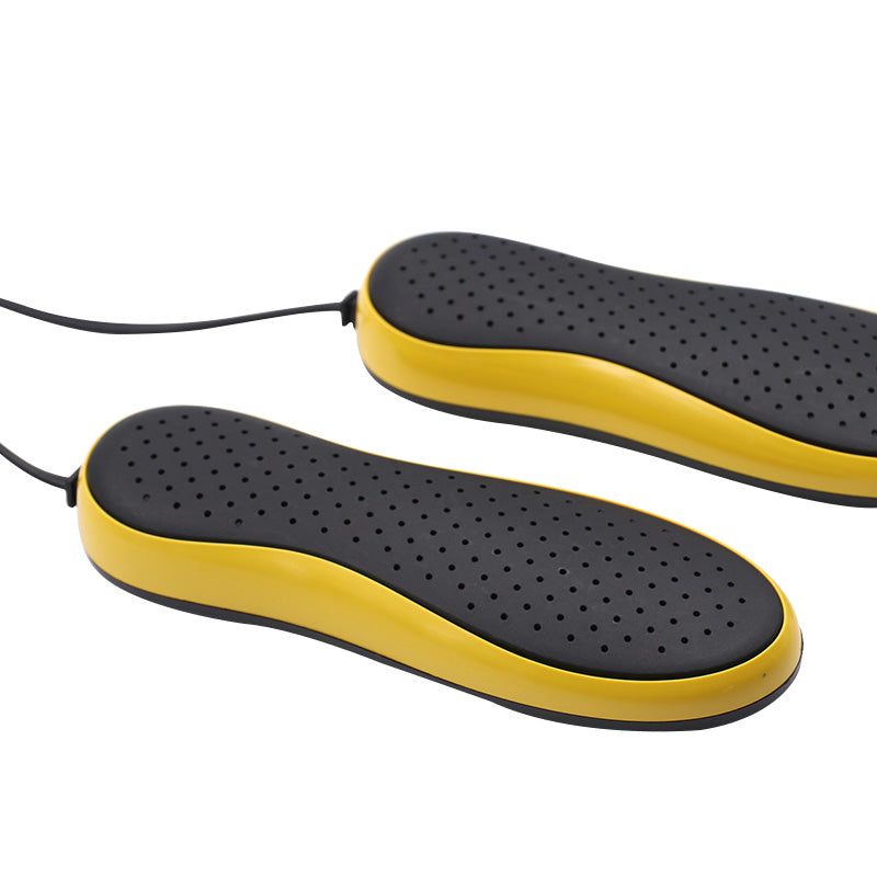 Black and yellow shoe inserts on a white background
