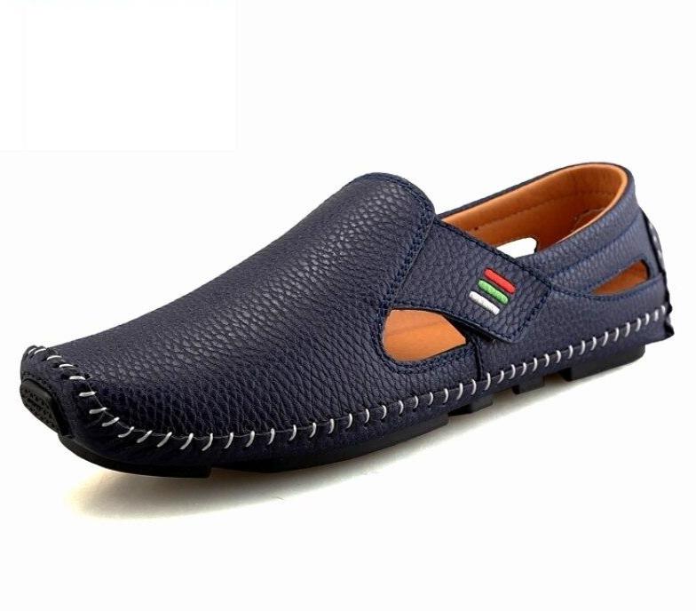 Navy blue loafer shoe with brown interior on a white background