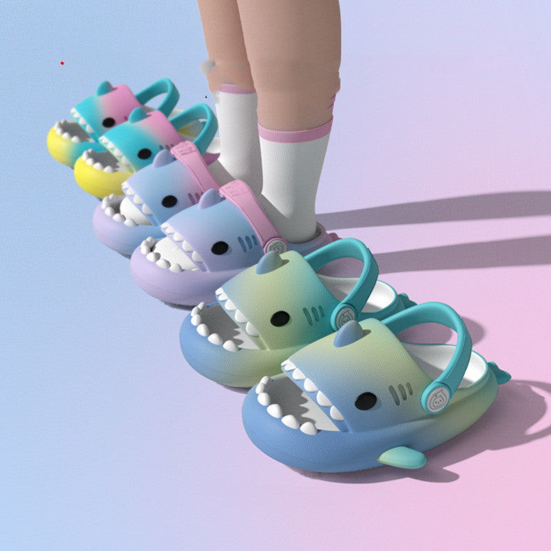 Colorful shark-shaped sandals on a gradient background