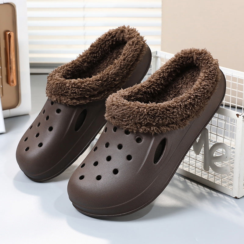 Brown slippers with fluffy collar on a light background