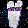 White and purple shoe dryer with decorative musical notes on a dark background