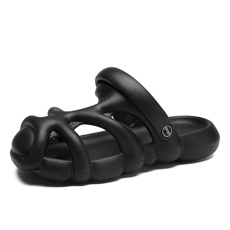 Black sandal with unique strap design on a white background