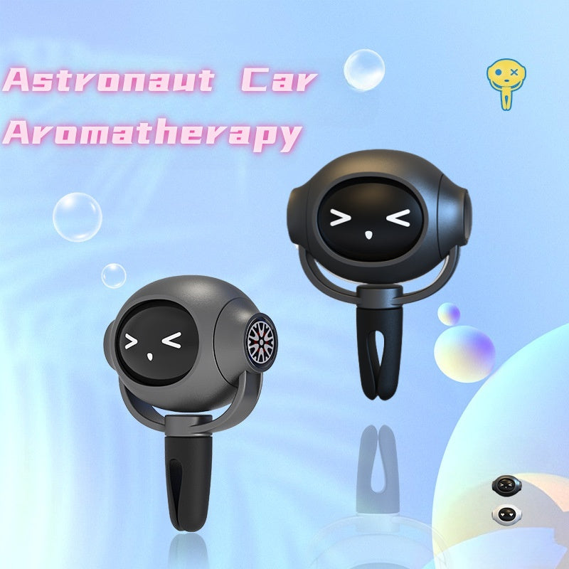 Two black car air freshener devices with a cartoonish face on a light blue background with bubbles and text.