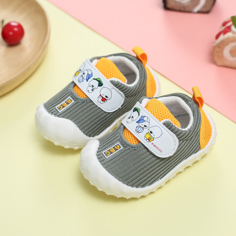 Pair of children's shoes with cartoon character design on a colorful background