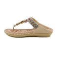 Beige sandal with floral design and beaded straps on a white background