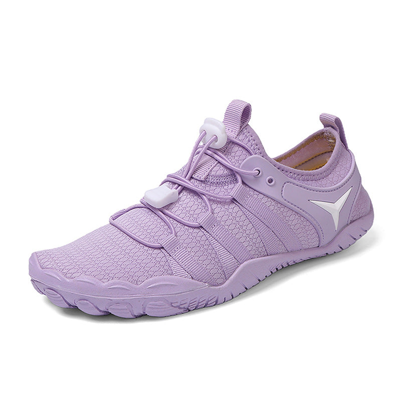 Purple athletic shoe with white sole on a white background