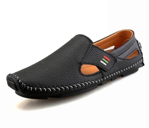 Black leather loafer shoe on a white background