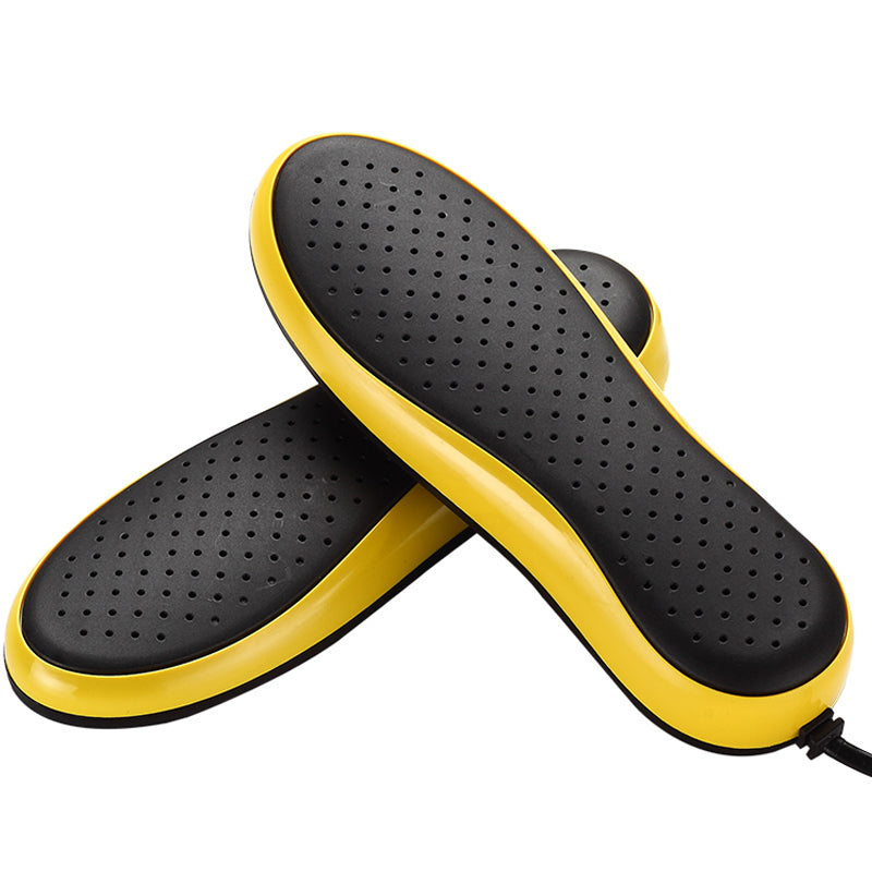 Black and yellow shoe inserts on a white background