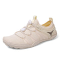 Beige athletic shoe with a logo on a white background