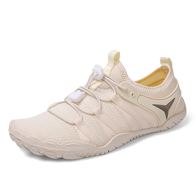 Beige athletic shoe with a logo on a white background