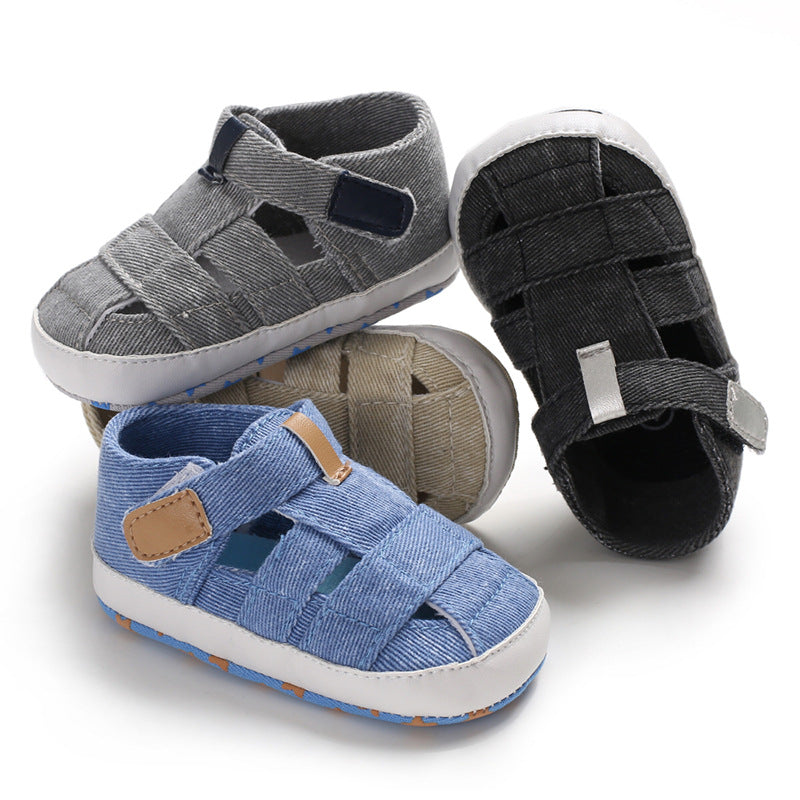Four pairs of children's sandals in gray, blue, and black on a white background