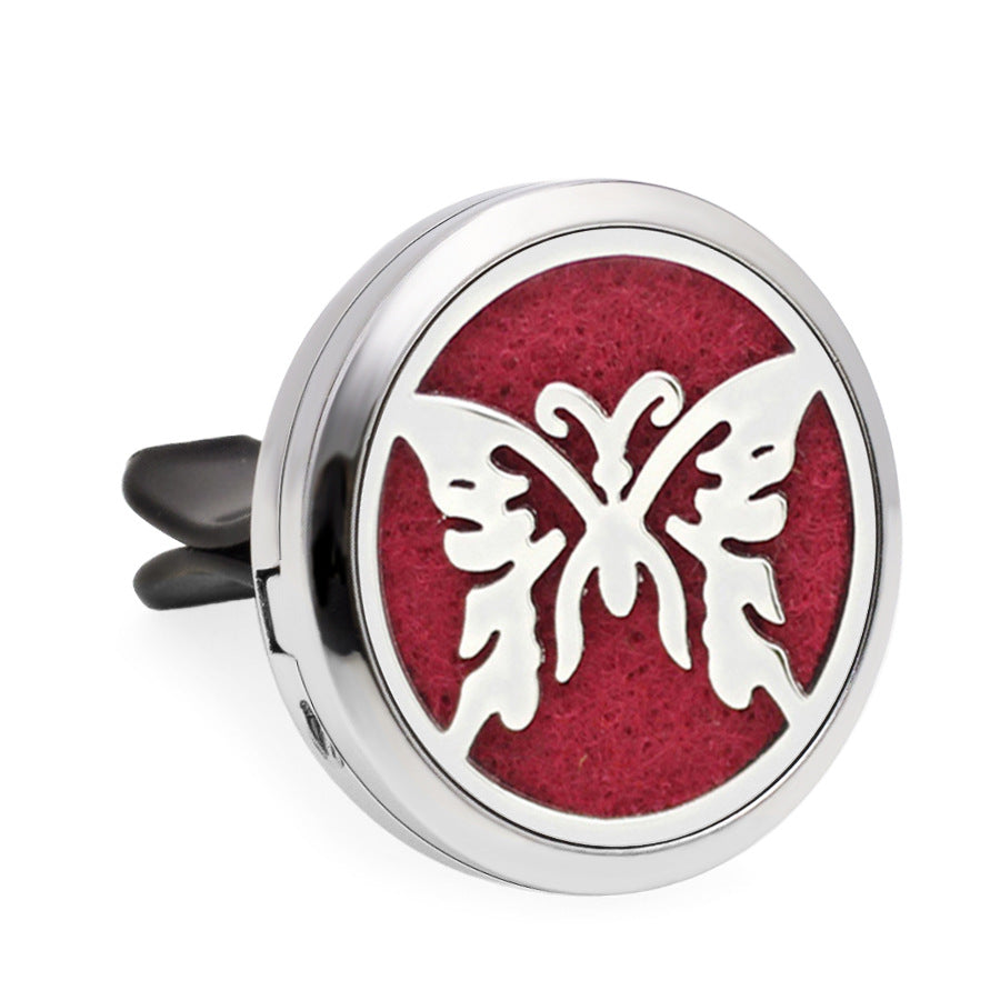 Round diffuser with butterfly design on a red background