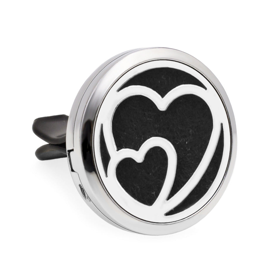 Round metallic diffuser with heart design on a white background