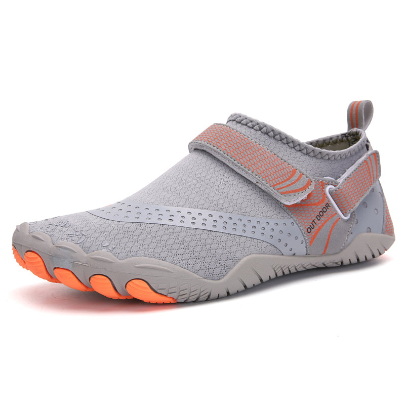 Gray water shoe with orange sole on a white background