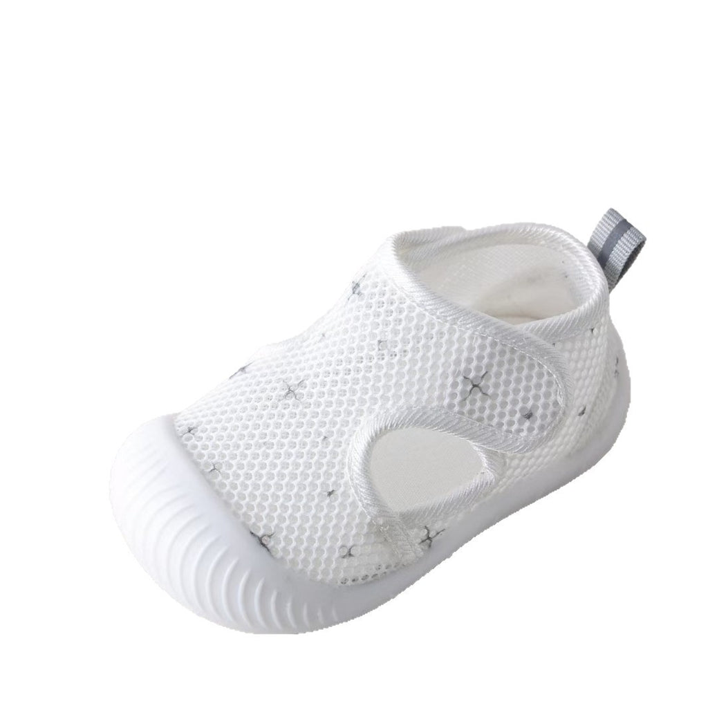 White baby shoe with mesh design on a white background