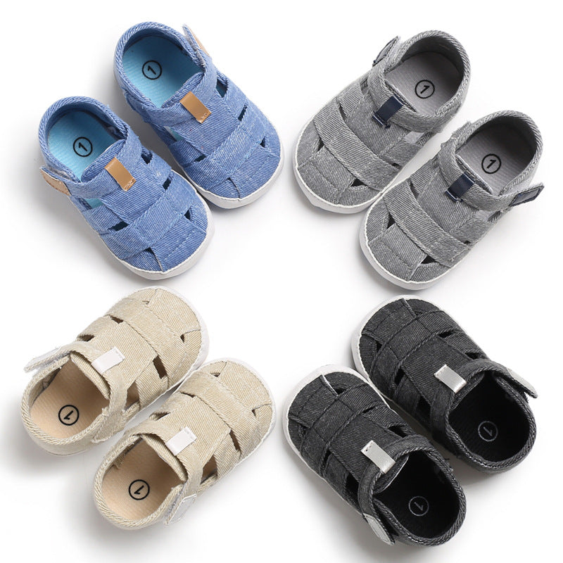 Set of baby sandals in blue, gray, beige, and black on a white background