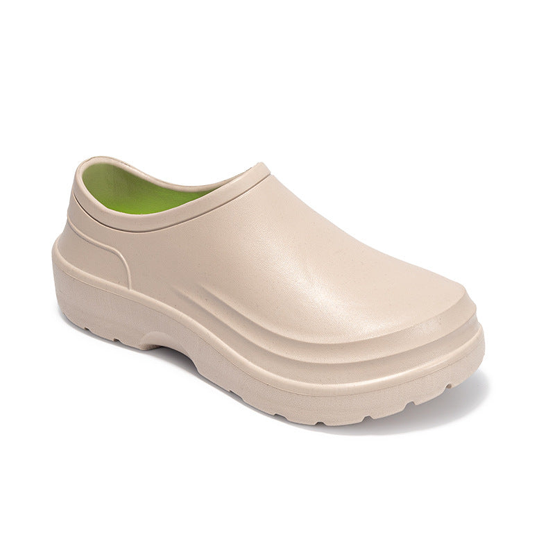Beige clog shoe with a green interior on a white background