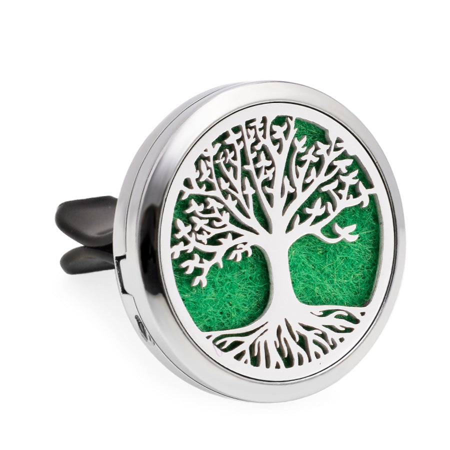 Round silver diffuser with tree of life design on a white background