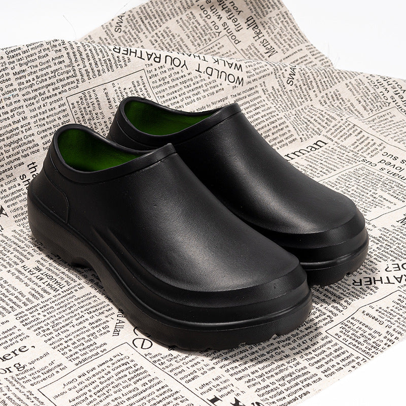 Black rubber shoes on a newspaper background