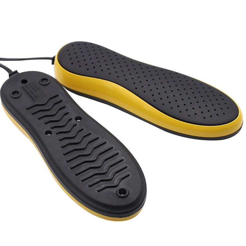 Black and yellow shoe inserts on a white background