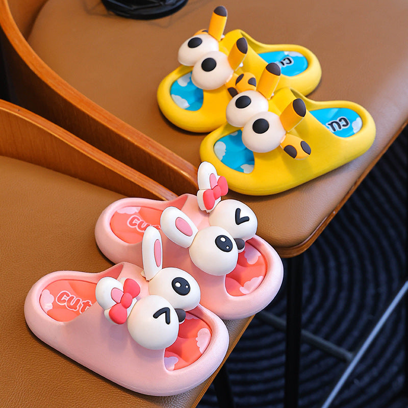 Cartoon-themed children's sandals on a brown surface