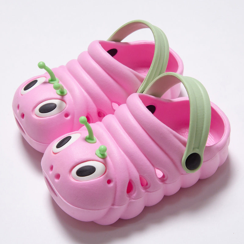 Pink caterpillar-shaped shoes with green antennas on a white background