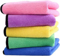 Stack of colorful microfiber cloths in pink, purple, yellow, green, and blue.