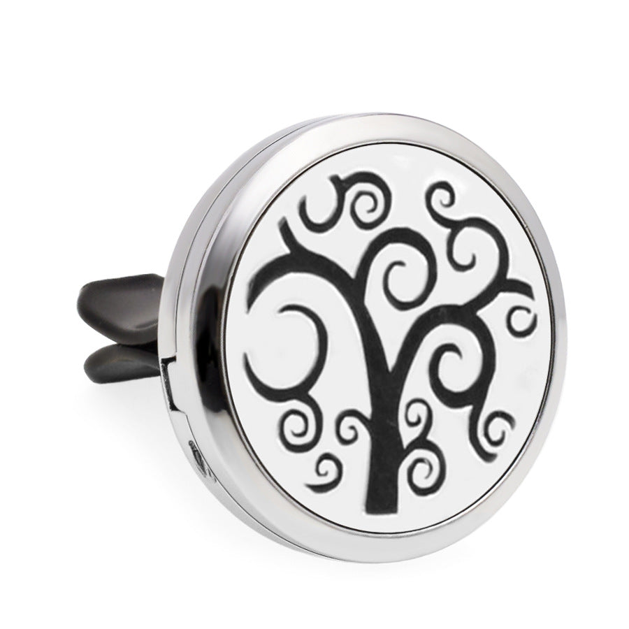 Round metallic diffuser with tree of life design on a white background