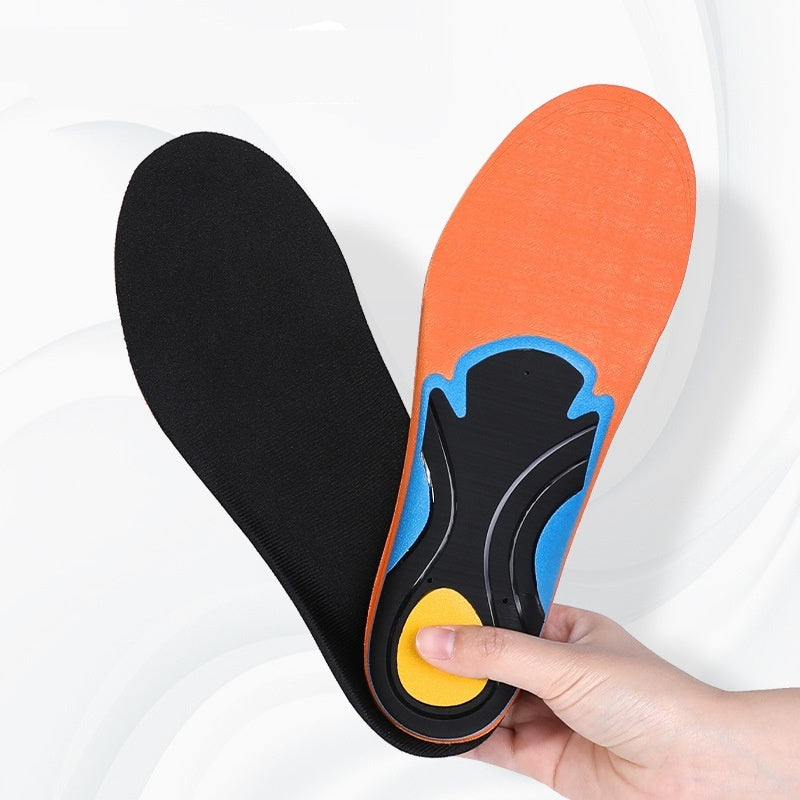 Black and orange shoe insoles with a hand holding them on a white background