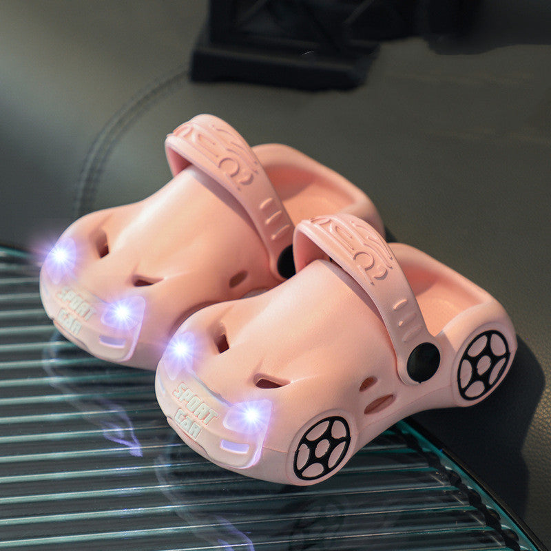 Pink LED slippers on a reflective surface