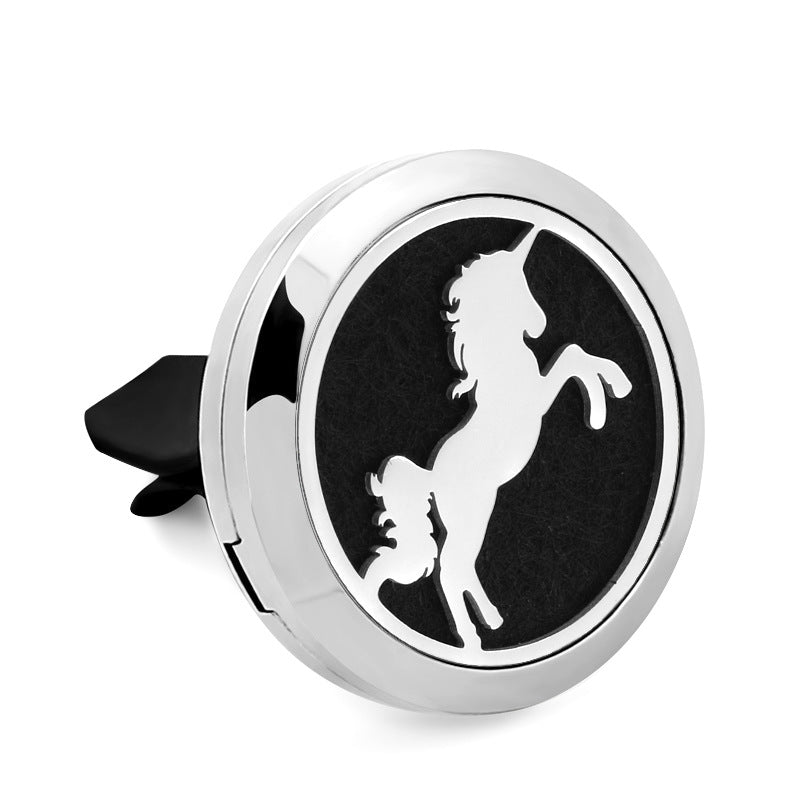 Round car air freshener with a white unicorn design on a black background