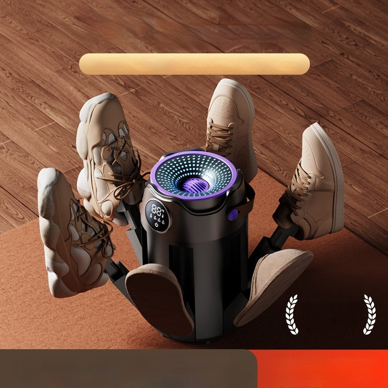 Person using a portable foot massager on a wooden floor