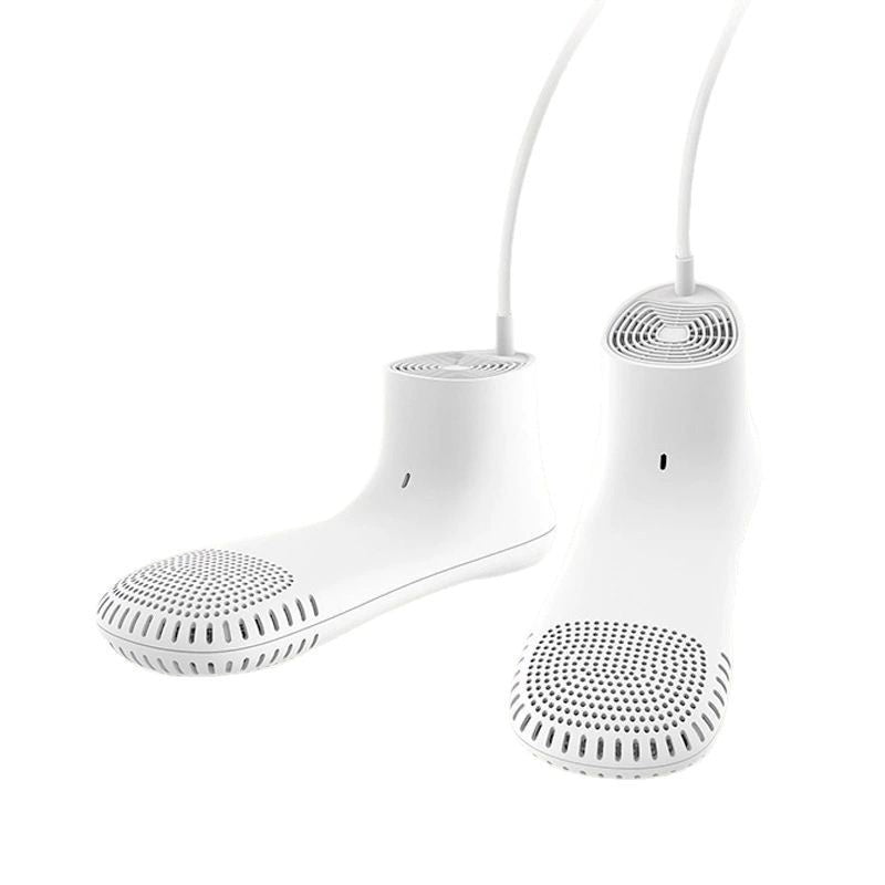 White shoe-shaped speaker with a cable on a white background