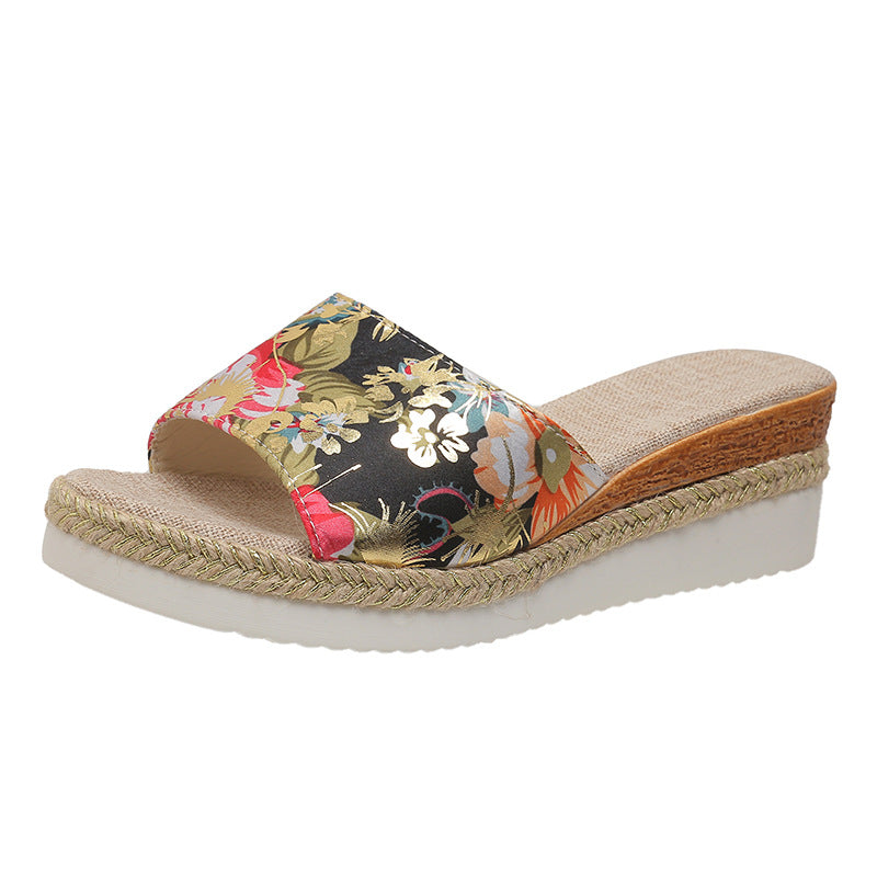 Floral wedge sandal with jute sole on a white background