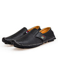 Black leather shoes with a white background