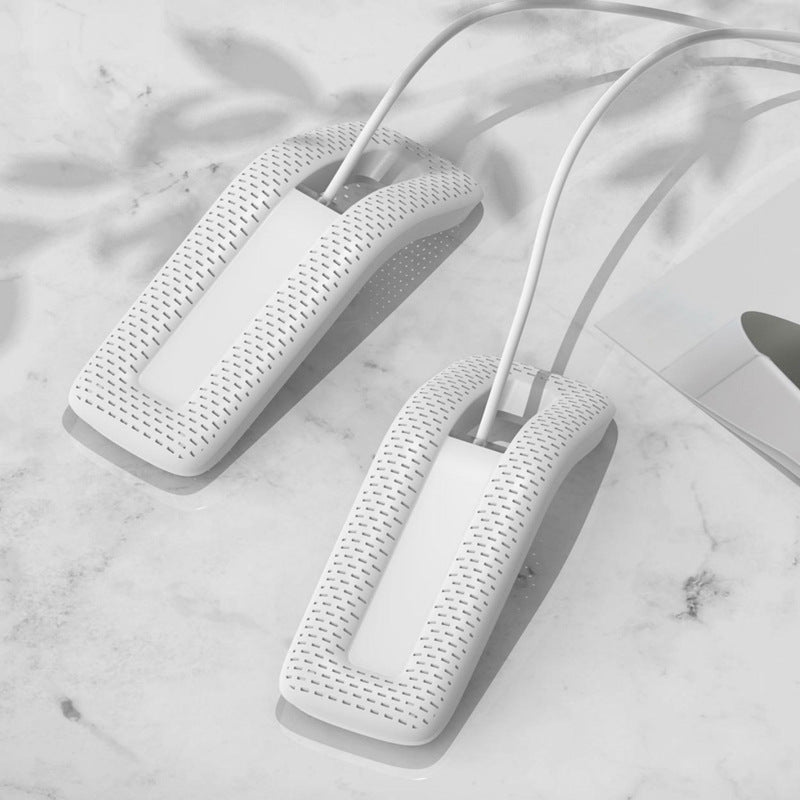 White shoe dryer on a marble surface