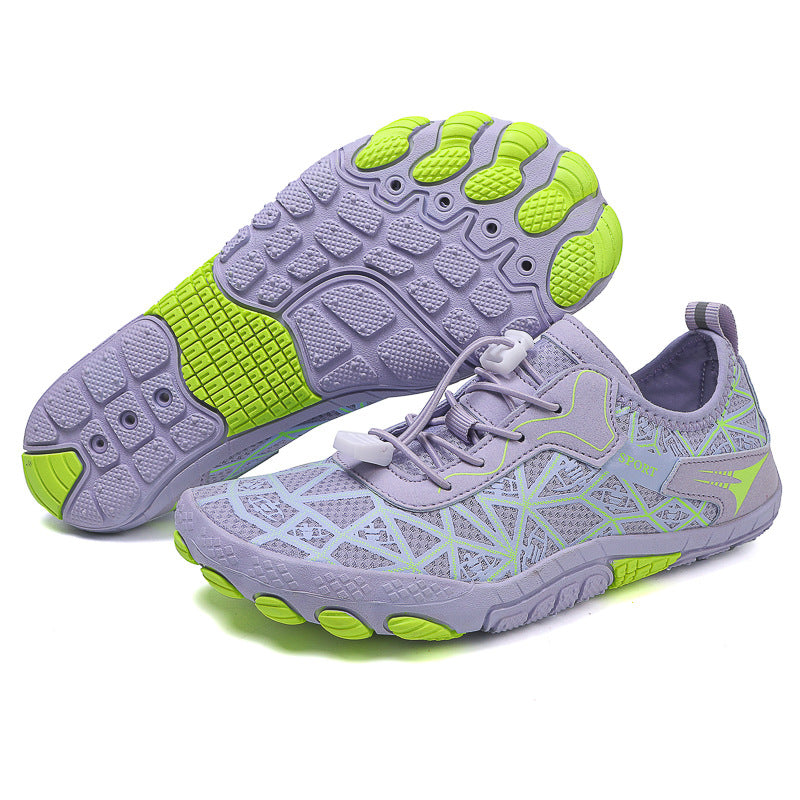 Pair of purple and green athletic shoes on a white background